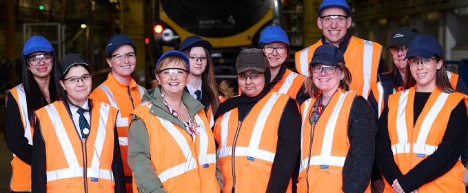 Students in high-vis vests visiting Manchester Traincare Centre on International Women’s Day